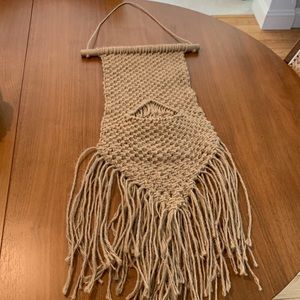 Boho woven wall hanging with pocket for plant.